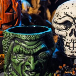 Mondo is accepting pre-orders for a set of stacking tiki mugs designed to look like the Silver Shamrock masks from Halloween III
