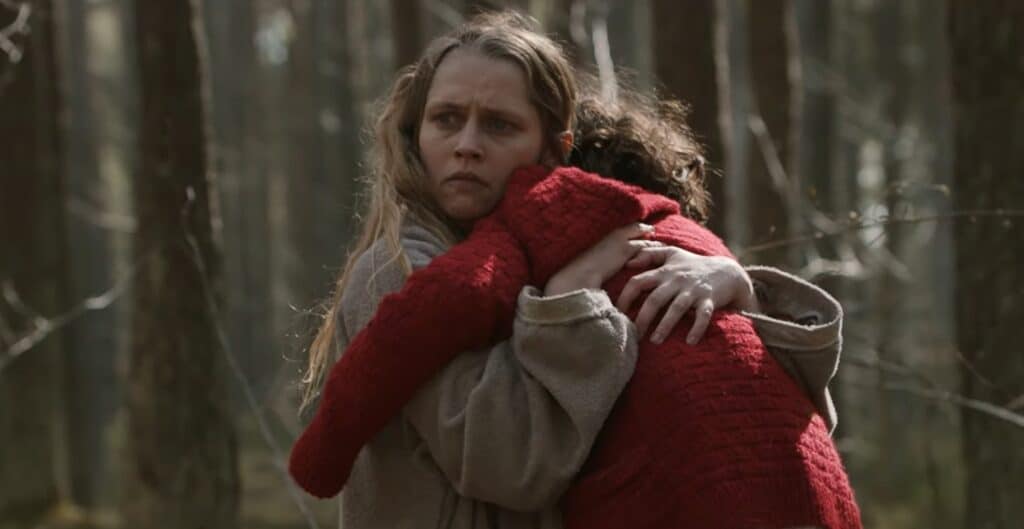 Teresa Palmer grips tightly onto her child in The Twin (2022).