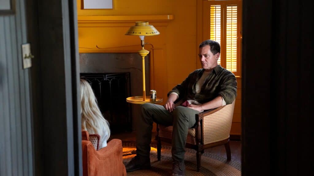 Michael Shannon stares at Emma Roberts in Abandoned (2022).