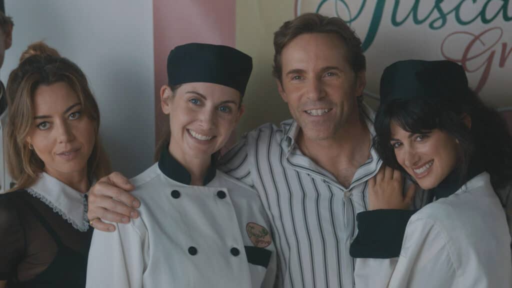 Aubrey Plaza as “Kat,” Alison Brie as “Amber,” Alessandro Nivola as “Nick,” and Ayden Mayeri as “Jen” in Jeff Baena’s SPIN ME ROUND. Courtesy of IFC Films. An IFC Films Release.