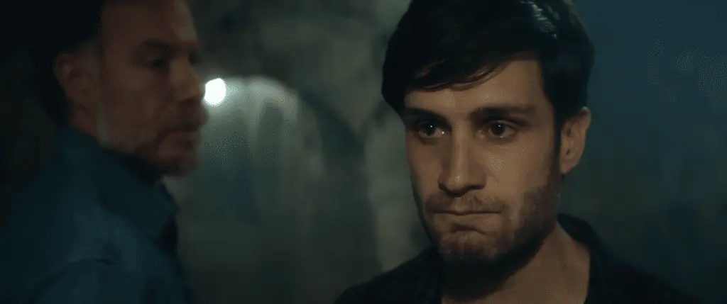 Michael Lombardi and Marc Menchaca in The Retaliators (2022).