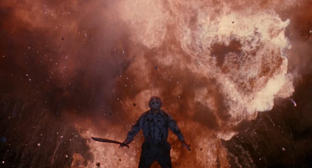 Jason Voorhees standing in front of an explosion