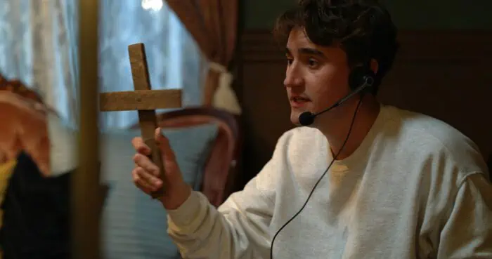 Will (Jon Michael Simpson) tries to protect himself against the demon in Sorry About The Demon (2023).