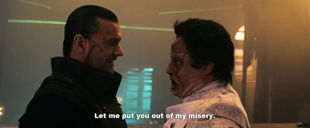 The Punisher looking at Jigsaw, saying "Let me put you out of my misery."