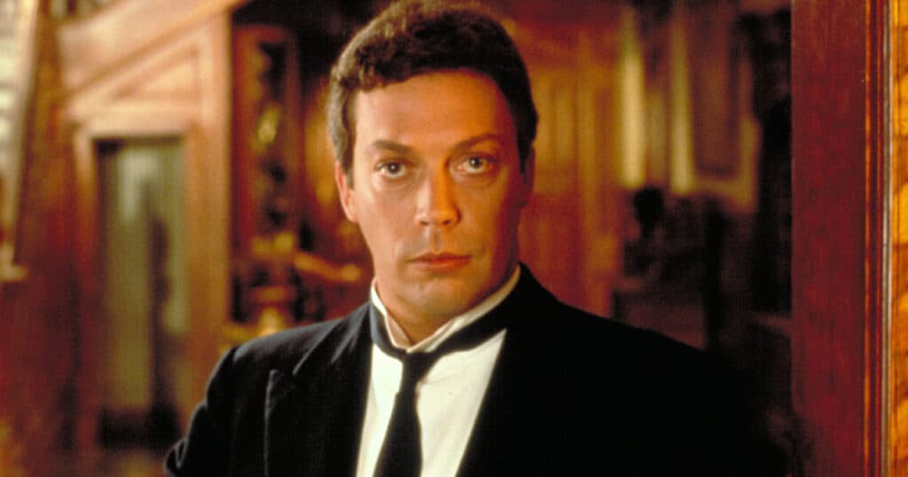 Tim Curry remembers “exhausting” Clue shoot
