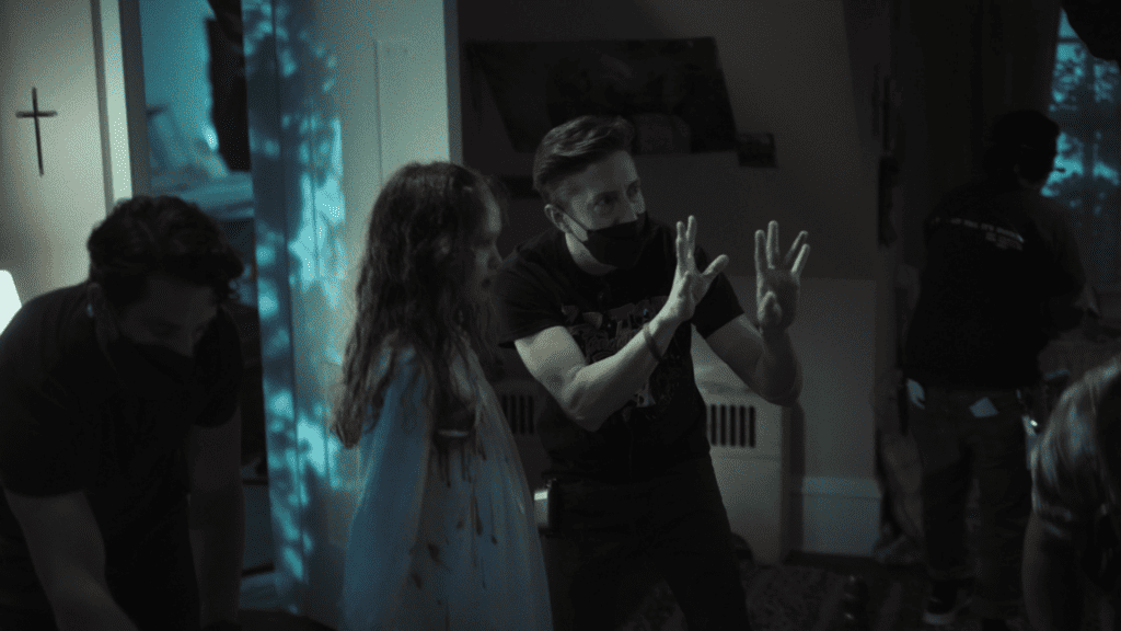 Director David Gordon Green directs Olivia O'Neill in The Exorcist: Believer (2023).