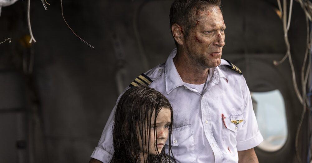 A first look image from Renny Harlin's shark thriller Deep Water shows Aaron Eckhart (accompanied by Molly Wright)