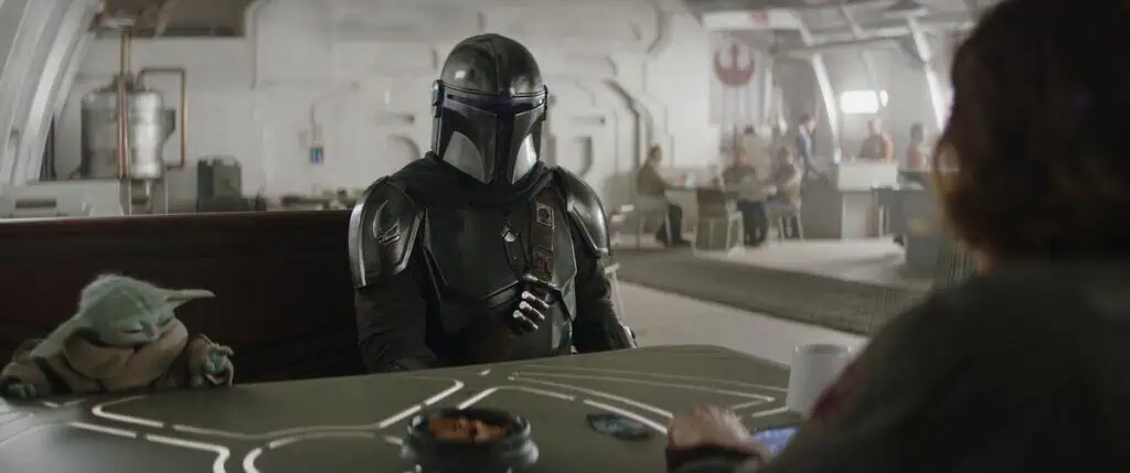 (L-R) Grogu, Mandalorian (Pedro Pascal), and Colonel Ward (Sigourney Weaver) in Lucasfilm's THE MANDALORIAN & GROGU. Photo courtesy of Lucasfilm. © 2025 Lucasfilm Ltd™. All Rights Reserved.